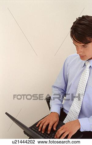 Businessman using laptop View Large Photo Image Stock Image - Businessman using laptop. Fotosearch