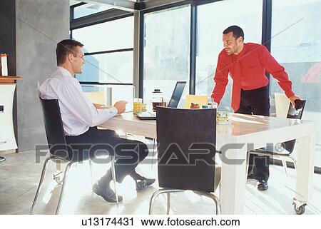 Businessmen eating breakfast together View Large Photo Image Stock Image - Businessmen eating breakfast together. Fotosearch