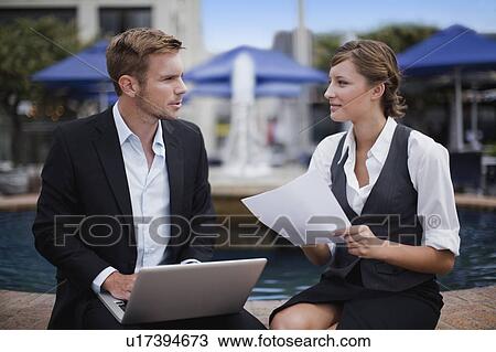 Businesspeople working by fountain View Large Photo Image Stock Image - Businesspeople working by fountain. Fotosearch