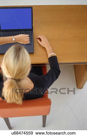 Businesswoman checking her watch View Large Photo Image Stock Photo - Businesswoman checking her watch. Fotosearch