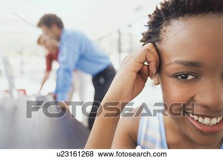 Stock Photo - Businesswoman eavesdropping in office. Fotosearch