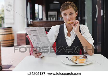 Businesswoman having breakfast View Large Photo Image Stock Photo - Businesswoman having breakfast. Fotosearch