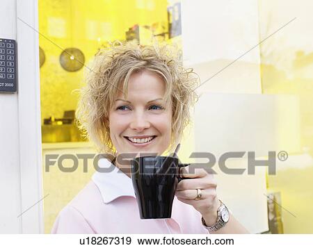 Businesswoman having coffee outdoors View Large Photo Image Stock Photo - Businesswoman having coffee outdoors. Fotosearch