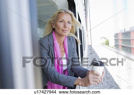 Picture - Businesswoman having cup of coffee. Fotosearch