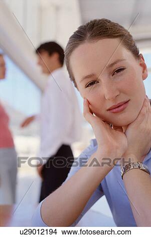 Businesswoman holding chin in hands View Large Photo Image Picture - Businesswoman holding chin in hands. Fotosearch