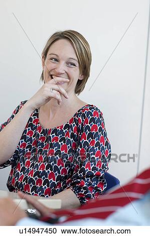 Businesswoman laughing in conference View Large Photo Image Stock Image - Businesswoman laughing in conference. Fotosearch
