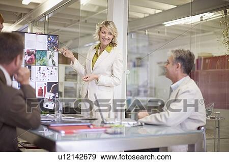 Stock Photo - Businesswoman making presentation. Fotosearch