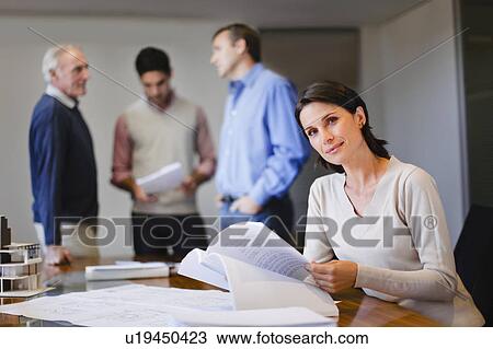 Businesswoman reading in meeting View Large Photo Image Stock Image - Businesswoman reading in meeting. Fotosearch