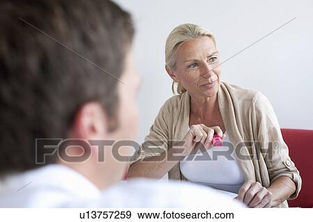 Businesswoman smiling in conference View Large Photo Image Stock Photo - Businesswoman smiling in conference. Fotosearch
