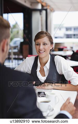 Businesswoman talking at lunch View Large Photo Image Stock Image - Businesswoman talking at lunch. Fotosearch