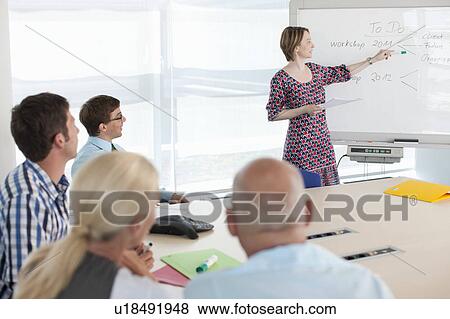 Stock Photo - Businesswoman talking in conference. Fotosearch