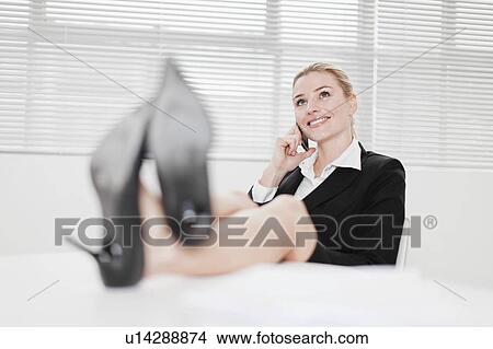Businesswoman talking on cell phone View Large Photo Image Picture - Businesswoman talking on cell phone. Fotosearch