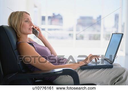 Businesswoman talking on cell phone View Large Photo Image Stock Image - Businesswoman talking on cell phone. Fotosearch