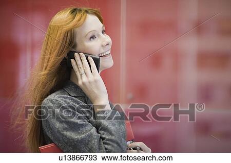 Businesswoman talking on cell phone View Large Photo Image Stock Image - Businesswoman talking on cell phone. Fotosearch