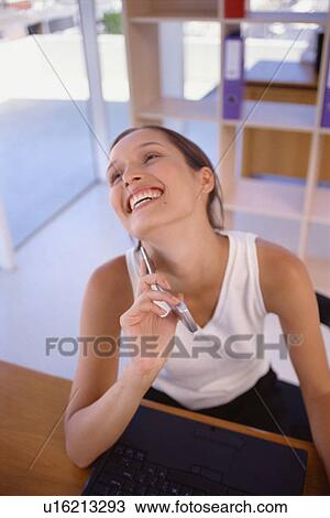 Businesswoman talking on cell phone View Large Photo Image Stock Image - Businesswoman talking on cell phone. Fotosearch