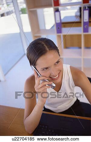Businesswoman talking on cell phone View Large Photo Image Stock Photography - Businesswoman talking on cell phone. Fotosearch