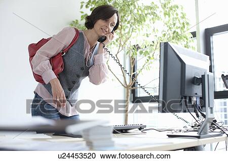 Businesswoman talking on phone View Large Photo Image Stock Image - Businesswoman talking on phone. Fotosearch