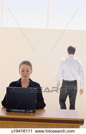 Businesswoman using laptop in office View Large Photo Image Stock Image - Businesswoman using laptop in office. Fotosearch