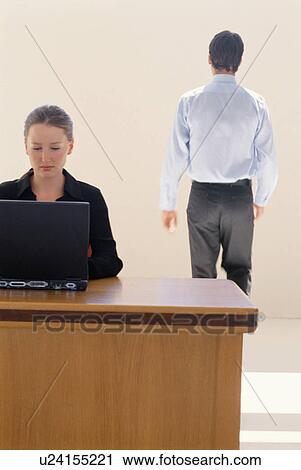 Businesswoman using laptop in office View Large Photo Image Stock Image - Businesswoman using laptop in office. Fotosearch