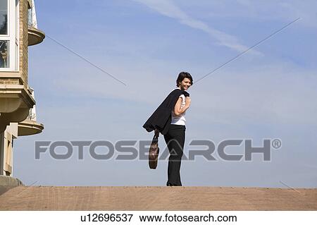 Businesswoman walking on street View Large Photo Image Stock Photo - Businesswoman walking on street. Fotosearch