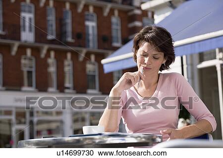 Businesswoman working at cafe View Large Photo Image Stock Image - Businesswoman working at cafe. Fotosearch