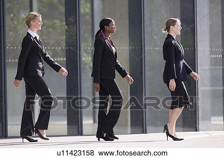 Stock Photo - Businesswomen marching in time. Fotosearch