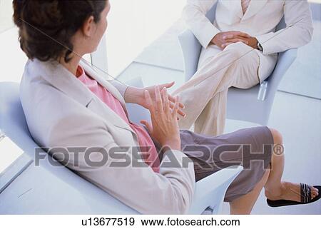 Businesswomen sitting in meeting View Large Photo Image Stock Photo - Businesswomen sitting in meeting. Fotosearch