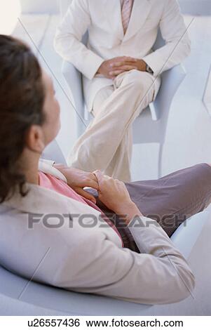 Businesswomen sitting in meeting View Large Photo Image Stock Photograph - Businesswomen sitting in meeting. Fotosearch