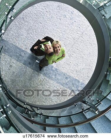 Businesswomen standing in stairwell View Large Photo Image Picture - Businesswomen standing in stairwell. Fotosearch