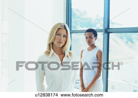 Picture - Businesswomen standing together. Fotosearch