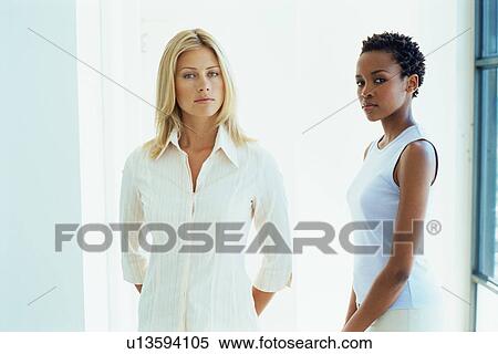 Businesswomen standing together View Large Photo Image Stock Photography - Businesswomen standing together. Fotosearch