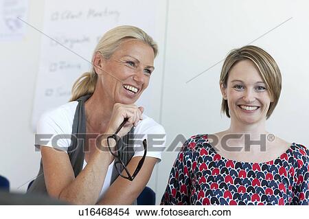 Businesswomen talking in conference View Large Photo Image Picture - Businesswomen talking in conference. Fotosearch