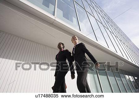 Businesswomen walking outside building View Large Photo Image Stock Photography - Businesswomen walking outside building. Fotosearch