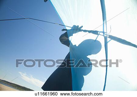 Child holding kite on beach View Large Photo Image Stock Image - Child holding kite on beach. Fotosearch