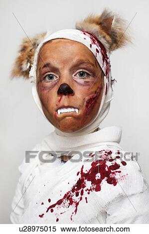 Stock Photography - Child in bloody Halloween costume. Fotosearch