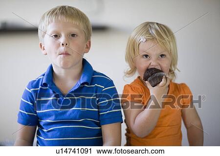 Stock Image - Children eating together. Fotosearch
