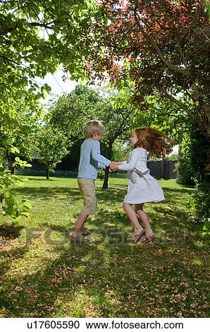 Children playing in backyard View Large Photo Image Stock Image - Children playing in backyard. Fotosearch