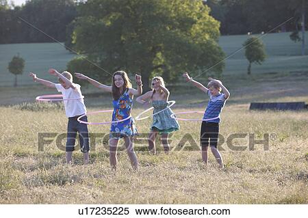 Children playing with hula hoops View Large Photo Image Stock Photography - Children playing with hula hoops. Fotosearch