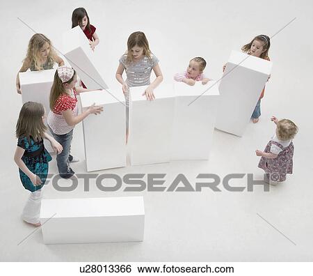 Children playing with large white blocks View Large Photo Image Stock Photograph - Children playing with large white blocks. Fotosearch