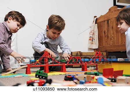 Children playing with toys together View Large Photo Image Stock Image - Children playing with toys together. Fotosearch