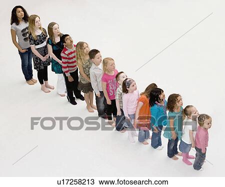 Children standing in a row View Large Photo Image Stock Image - Children standing in a row. Fotosearch