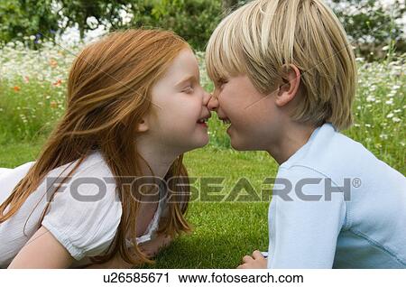 Children touching noses in field View Large Photo Image Stock Image - Children touching noses in field. Fotosearch