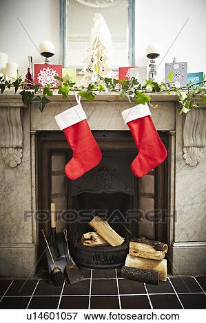 Christmas stockings hung on fireplace View Large Photo Image Stock Photo - Christmas stockings hung on fireplace. Fotosearch