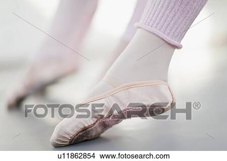Picture - Close up of ballet dancer’s foot. Fotosearch