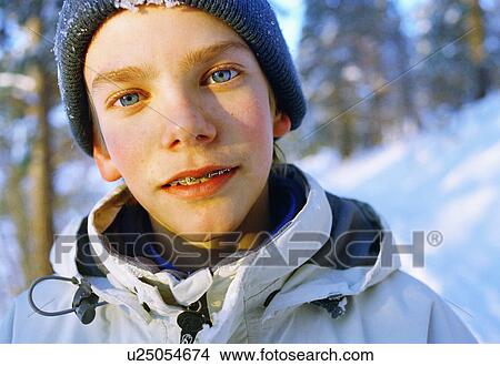 Close up of boy with braces in parka View Large Photo Image Picture - Close up of boy with braces in parka. Fotosearch