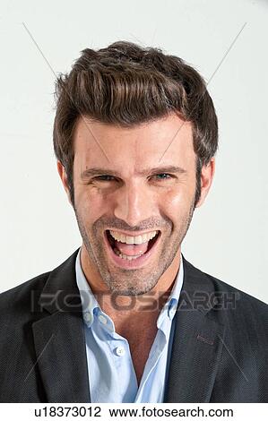 Stock Image - Close up of businessman laughing. Fotosearch
