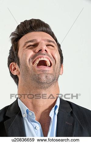 Stock Photo - Close up of businessman laughing. Fotosearch