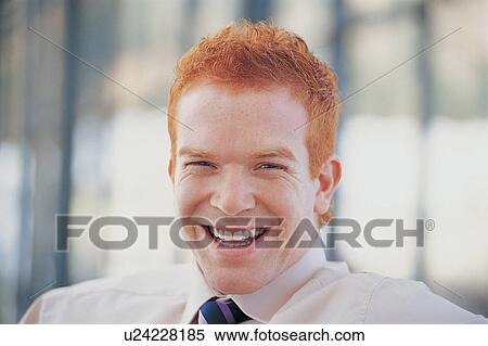 Stock Photography - Close up of businessman laughing. Fotosearch