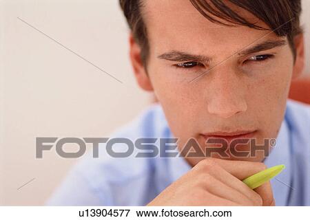 Close up of businessman thinking View Large Photo Image Stock Photo - Close up of businessman thinking. Fotosearch