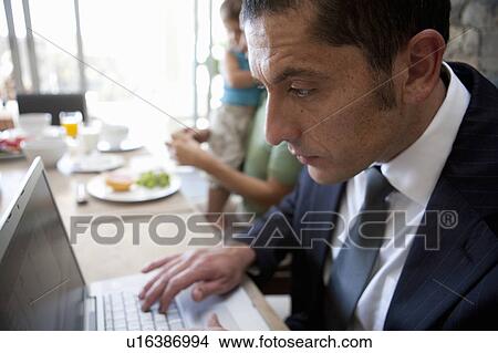 Picture - Close up of businessman using laptop. Fotosearch